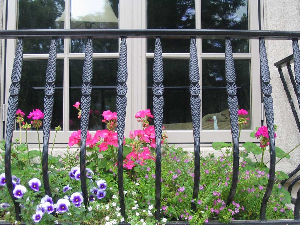 Ornamental iron fence installation job site photo